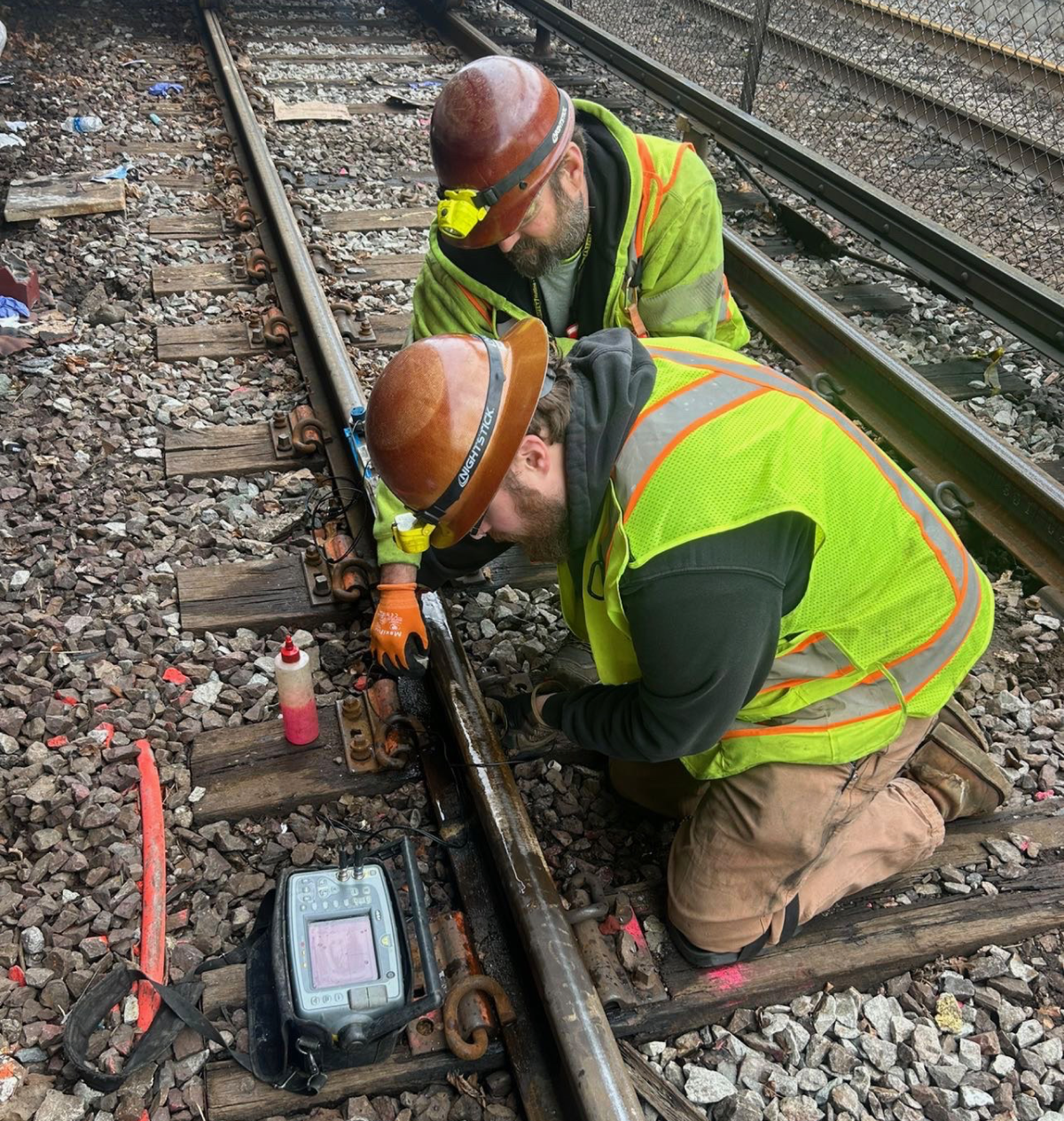 Maintenance crew checking railway equipment